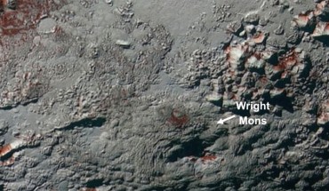 The Wright Mons region on Pluto: darker/lower albedo, redder patches exist primarily on north-facing slopes but there are also more subtle differences in albedo and redness across the region; the region labeled A represents a redder unit transition to less red units at lower elevation. The longitude and latitude extents of the image are 160-182°E and 13-31°S. Image credit: Singer et al., doi: 10.1038/s41467-022-29056-3.