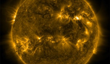 SDO captured this image of an X-class solar flare -- as seen in the bright flash in the top right portion of the image -- on March 30, 2022. The image shows a subset of extreme UV light that highlights the extremely hot material in flares and which is colorized in yellow (AIA 171). Image credit: NASA / SDO.