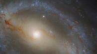 This image shows NGC 5921, a barred spiral galaxy some 78 million light-years away in the constellation of Serpens. This picture was created from images taken with Hubble’s Wide Field Camera 3 (WFC3). One optical and two infrared filter were used to sample various wavelengths. The color results from assigning different hues to each monochromatic image associated with an individual filter. Image credit: NASA / ESA / Hubble / J. Walsh / R. Colombari.