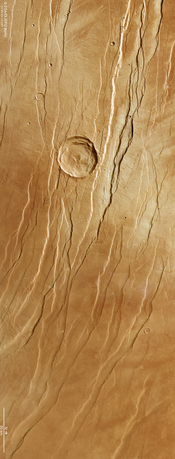 This image, taken on July 19, 2021 by the High Resolution Stereo Camera (HRSC) on board ESA’s Mars Express spacecraft, shows part of Tantalus Fossae on Mars. Image credit: ESA / DLR / FU Berlin / CC BY-SA 3.0 IGO.