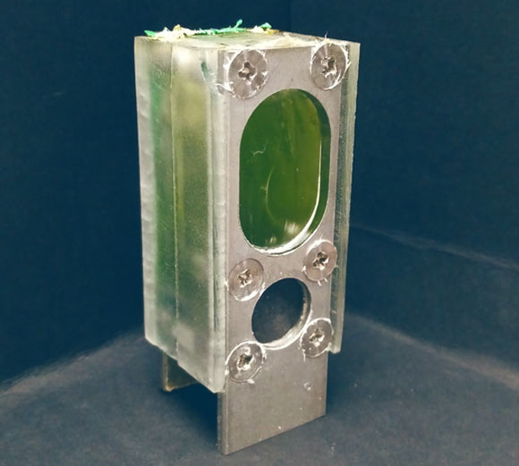This system, containing Synechocystis blue-green algae, powered a microprocessor continuously for a year using nothing but ambient light and water. Image credit: Paolo Bombelli.