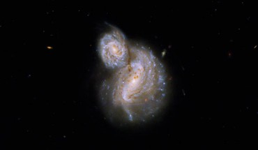 This Hubble image shows IC 4271, a pair of superimposed spiral galaxies some 800 million light-years away in the constellation of Canes Venatici. Image credit: NASA / ESA / B. Holwerda, University of Louisville Research Foundation, Inc. / G. Kober, NASA’s Goddard Space Flight Center / Catholic University of America.