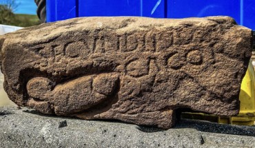 The ancient carved stone with the image of a phallus and graffiti found at the site of Vindolanda in Northumberland, England. Image credit: Vindolanda Trust.