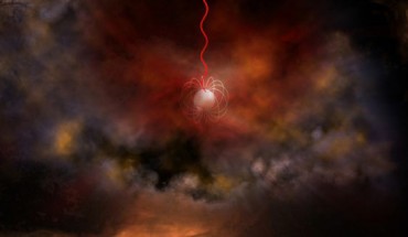 An artist’s conception of a neutron star with an ultra-strong magnetic field, called a magnetar, emitting radio waves (red). Image credit: Bill Saxton, NRAO / AUI / NSF.