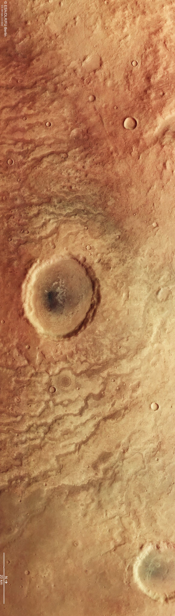 This image shows part of the scarred and colorful landscape in Aonia Terra, Mars. The image comprises data gathered by Mars Express’ High Resolution Stereo Camera (HRSC) on April 25, 2022. It was created using data from the nadir channel, the field of view aligned perpendicular to the surface of Mars, and the color channels of the HRSC. Image credit: ESA / DLR / FU Berlin.