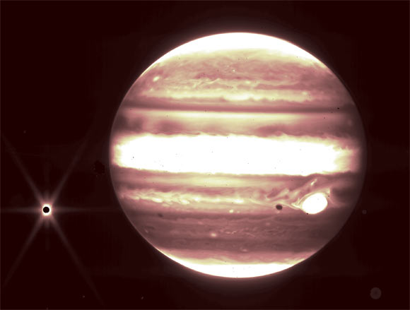 This image from Webb’s NIRCam instrument 2.12 micron filter shows Jupiter (center) and its moon Europa (left). Image credit: NASA / ESA / CSA / B. Holler & J. Stansberry, STScI.