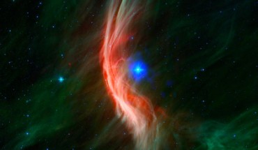 Zeta Ophiuchi was once in close orbit with another star, before being ejected when this companion was destroyed in a supernova explosion; infrared data from Spitzer reveal a spectacular shock wave (red and green) that was formed by matter blowing away from the star’s surface and slamming into gas in its path; data from Chandra (blue) show a bubble of X-ray emission located around the star, produced by gas that has been heated by the shock wave to tens of millions of degrees. Image credit: NASA / CXC / University of Cambridge / Sisk-Reynés et al. / NSF / NRAO / VLA / PanSTARRS.
