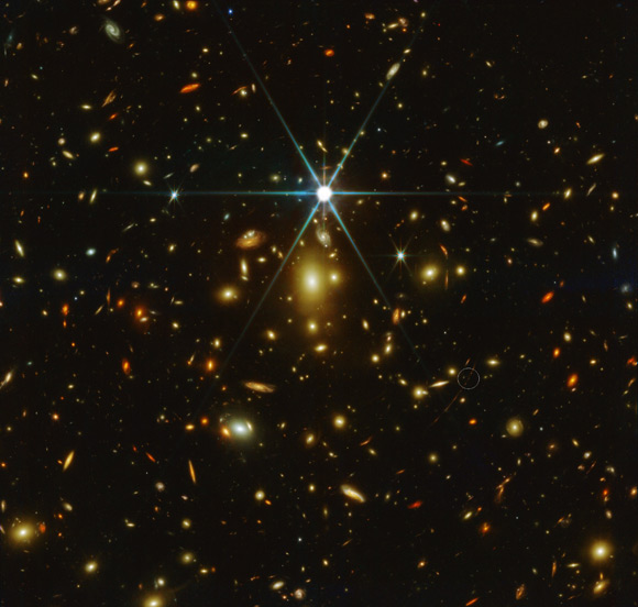 This Webb/NIRCam image shows the massive galaxy cluster WHL0137-08; Earendel is indicated by white circle. Image credit: NASA / ESA / CSA / STScI.