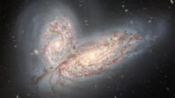 This image from the Gemini North telescope shows a pair of interacting spiral galaxies: NGC 4568 (bottom) and NGC 4567 (top). Image credit: International Gemini Observatory / NOIRLab / NSF / AURA / T.A. Rector, University of Alaska Anchorage & NSF’s NOIRLab / J. Miller, Gemini Observatory & NSF’s NOIRLab / M. Zamani, NSF’s NOIRLab / D. de Martin, NSF’s NOIRLab.