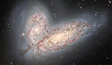 This image from the Gemini North telescope shows a pair of interacting spiral galaxies: NGC 4568 (bottom) and NGC 4567 (top). Image credit: International Gemini Observatory / NOIRLab / NSF / AURA / T.A. Rector, University of Alaska Anchorage & NSF’s NOIRLab / J. Miller, Gemini Observatory & NSF’s NOIRLab / M. Zamani, NSF’s NOIRLab / D. de Martin, NSF’s NOIRLab.