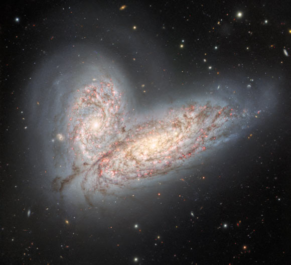 This image from the Gemini North telescope shows a pair of interacting spiral galaxies: NGC 4568 (bottom) and NGC 4567 (top). Image credit: International Gemini Observatory / NOIRLab / NSF / AURA / T.A. Rector, University of Alaska Anchorage & NSF’s NOIRLab / J. Miller, Gemini Observatory & NSF’s NOIRLab / M. Zamani, NSF’s NOIRLab / D. de Martin, NSF’s NOIRLab.