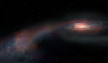 This artist’s conception shows the stream of gas and stars that were flung away from a massive galaxy during its merger with a smaller galaxy. Image credit: ALMA / ESO / NAOJ / NRAO / S. Dagnello, NRAO, AUI & NSF.