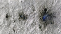 These craters were formed by a meteoroid impact on Mars on September 5, 2021, the first to be detected by NASA’s InSight lander; taken by NASA’s Mars Reconnaissance Orbiter, this enhanced-color image highlights the dust and soil disturbed by the impact in blue in order to make details more visible to the human eye. Image credit: NASA / JPL-Caltech / University of Arizona.