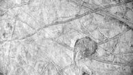 This Juno photo of the surface of Europa reveals a curious feature surrounded by a vast network of linear ridges and dark blotches. It was obtained by Juno’s Stellar Reference Unit (SRU) during the spacecraft’s September 29, 2022, flyby of Europa at a distance of about 412 km. Image credit: NASA / JPL-Caltech / SwRI.