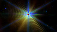 This Webb/MIRI image shows the binary system WR 140; eight symmetric diffraction spikes are seen around the saturated core of WR 140 that exhibit bluer colors than the dust emission. Image credit: Lau et al., doi: 10.1038/s41550-022-01812-x.