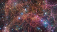 This image, taken by the OmegaCAM camera at ESO’s VLT Survey Telescope, shows a spectacular view of the orange and pink clouds that make up the Vela SNR. OmegaCAM can take images through several filters that let through light of different colors. In this particular image of the Vela SNR, four different filters were used, represented here by a combination of magenta, blue, green and red. Image credit: ESO / VPHAS+ Team / Cambridge Astronomical Survey Unit.