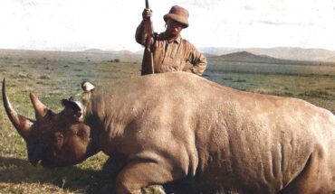 This colorized photo shows American President Theodore Roosevelt standing behind the carcass of a rhinocerous. Image credit: U.S. Library of Congress.