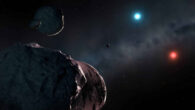 An artist’s impression of the white dwarfs WD J2147-4035 and WD J1922+0233 surrounded by orbiting planetary debris, which will accrete onto the stars and pollute their atmospheres. WD J2147-4035 is extremely red and dim, while WD J1922+0233 is unusually blue. Image credit: Mark Garlick / University of Warwick.
