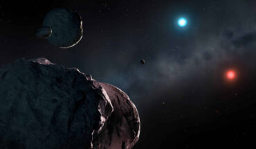 An artist’s impression of the white dwarfs WD J2147-4035 and WD J1922+0233 surrounded by orbiting planetary debris, which will accrete onto the stars and pollute their atmospheres. WD J2147-4035 is extremely red and dim, while WD J1922+0233 is unusually blue. Image credit: Mark Garlick / University of Warwick.