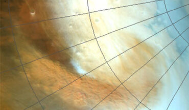 A spiral-shaped dust storm is visible in this image taken by the High Resolution Stereo Camera (HRSC) imager on ESA’s Mars Express spacecraft. This image, taken on May 26, 2019, depicts the formation of a spiral shape whose main arm is approximately 2,000 km in length. A granular pattern of dust cells is visible in the storm, formed by a process called closed-cell convection. This type of convection is also responsible for some cloud patterns on Earth. Image credit: ESA / DLR / FU Berlin.