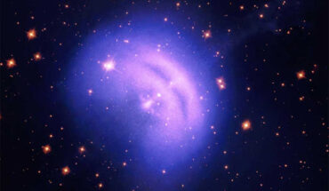 This image shows the Vela pulsar wind nebula: light blue represents X-ray polarization data from IXPE; pink and purple colors correspond to data from NASA’s Chandra X-ray observatory; the NASA/ESA Hubble Space Telescope contributed the stars in the background. Image credit: IXPE / NASA / MSFC / Fei Xie / CXC / SAO / STScI / Hubble / Chandra / Judy Schmidt / Kimberly Arcand / Nancy Wolk.