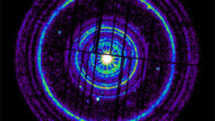 ESA’s XMM-Newton X-ray observatory recorded 20 dust rings, 19 of which are shown here in arbitrary colors. The image merges observations made two and five days after GRB 221009A erupted. Dark stripes indicate gaps between the detectors. A detailed analysis shows that the widest ring visible here, comparable to the apparent size of a full Moon, came from dust clouds located about 1,300 light-years away. The innermost ring arose from dust at a distance of 61,000 light-years -- on the other side of our Galaxy. Image credit: ESA / XMM-Newton / M. Rigoselli, INAF.