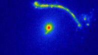 This image shows the strong-lensing galaxy Abell 1201 BCG and a gravitational arc. Image credit: NASA / ESA / Hubble / Nightingale et al., doi: 10.1093/mnras/stad587.