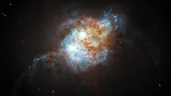 This artist’s concept shows the brilliant glare of two quasars residing in the cores of two galaxies that are in the chaotic process of merging. Image credit: NASA / ESA / Joseph Olmsted, STScI.