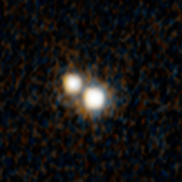 This Hubble image shows a pair of quasars that existed when the Universe was just 3 billion years old. They are embedded inside a pair of colliding galaxies called SDSS J0749+2255. Image credit: NASA / ESA / Yu-Ching Chen, UIUC / Hsiang-Chih Hwang, IAS / Nadia Zakamska, JHU / Yue Shen, UIUC.