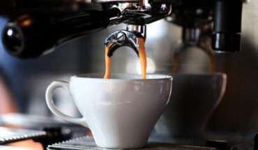 Espresso coffee is brewed by first grinding roasted coffee beans into grains. Hot water then forces its way through a bed of coffee grains at high pressure, and the soluble content of the coffee grains dissolves into the water (extraction) to produce espresso.