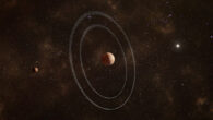 An artist’s impression of Quaoar and its two rings. Quaoar’s moon Weywot is shown on the left. Image credit: ESA / Sci.News.