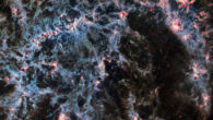 In this image of NGC 5068, from Webb’s MIRI instrument, the dusty structure of the spiral galaxy and glowing bubbles of gas containing newly-formed star clusters are particularly prominent. Three asteroid trails intrude into this image, represented as tiny blue-green-red dots. Image credit: NASA / ESA / CSA / Webb / J. Lee / PHANGS-JWST Team.