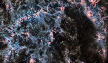 In this image of NGC 5068, from Webb’s MIRI instrument, the dusty structure of the spiral galaxy and glowing bubbles of gas containing newly-formed star clusters are particularly prominent. Three asteroid trails intrude into this image, represented as tiny blue-green-red dots. Image credit: NASA / ESA / CSA / Webb / J. Lee / PHANGS-JWST Team.