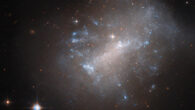 This Hubble image shows NGC 7292, an irregular galaxy some 44 million light-years away in the constellation of Pegasus. The color image was made from separate exposures taken in the visible and near-infrared regions of the spectrum Hubble’s Advanced Camera for Surveys (ACS). Two filters were used to sample various wavelengths. The color results from assigning different hues to each monochromatic image associated with an individual filter. Image credit: NASA / ESA / Hubble / C. Kilpatrick.