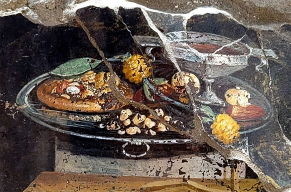 The 2,000-year-old fresco in Pompeii showing what may be an ancestor of modern pizza. Image credit: Pompeii archeological park.