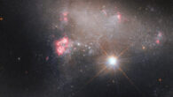 This Hubble image shows Arp 263, an irregular galaxy located 27.1 million light-years away in the constellation of Leo. The color image of Arp 263 was made from separate exposures taken in the visible and near-infrared regions of the spectrum with Hubble’s Advanced Camera for Surveys and Wide Field Camera 3. Two filters were used to sample various wavelengths. The color results from assigning different hues to each monochromatic image associated with an individual filter. Image credit: NASA / ESA / Hubble / J. Dalcanton / A. Filippenko.