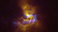 This composite image shows V960 Mon, a young star located over 5,000 light-years away in the constellation of Monoceros. Observations obtained using the Spectro-Polarimetric High-contrast Exoplanet REsearch (SPHERE) instrument on ESO’s VLT, represented in yellow in this image, show that the dusty material orbiting V960 Mon is assembling together in a series of intricate spiral arms extending to distances greater than the entire Solar System. Meanwhile, the blue regions represent data obtained with ALMA. The ALMA data peers deeper into the structure of the spiral arms, revealing large dusty clumps that could contract and collapse to form giant planets roughly the size of Jupiter via a process known as gravitational instability. Image credit: ESO / ALMA / NAOJ / NRAO / Weber et al.