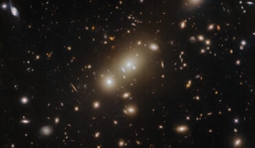This Hubble image shows ACO 3322, a very massive galaxy cluster located 2.6 billion light-years away in the constellation of Pictor. Image credit: NASA / ESA / Hubble / H. Ebeling.