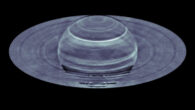For most of the time, Saturn’s atmosphere looks hazy and featureless to the naked eye in contrast to Jupiter’s colorful and vibrant atmosphere. This picture changes when we look at Saturn using a radio eye. Despite bland looking at the visible wavelengths, different latitudes on Saturn show dramatic contrast in the radio emission. In 2015, Li et al. found substantial brightness temperature variations -- greater than the temperature increase caused by the 2010 storm -- as a function of latitude and radio wavelength based on spatially resolved radio images of Saturn, as obtained from the VLA. Via a spectral inversion study, they created a latitude-altitude map of ammonia concentration anomalies from these images and correlate the anomalies to the occurrences of past giant storms in the northern hemisphere. Image credit: S. Dagnello / NRAO / AUI / NSF / Li et al., doi: 10.1126/sciadv.adg9419.