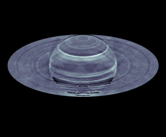 For most of the time, Saturn’s atmosphere looks hazy and featureless to the naked eye in contrast to Jupiter’s colorful and vibrant atmosphere. This picture changes when we look at Saturn using a radio eye. Despite bland looking at the visible wavelengths, different latitudes on Saturn show dramatic contrast in the radio emission. In 2015, Li et al. found substantial brightness temperature variations -- greater than the temperature increase caused by the 2010 storm -- as a function of latitude and radio wavelength based on spatially resolved radio images of Saturn, as obtained from the VLA. Via a spectral inversion study, they created a latitude-altitude map of ammonia concentration anomalies from these images and correlate the anomalies to the occurrences of past giant storms in the northern hemisphere. Image credit: S. Dagnello / NRAO / AUI / NSF / Li et al., doi: 10.1126/sciadv.adg9419.