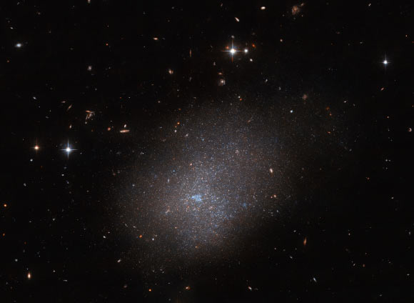 This Hubble image shows ESO 300-16, a dwarf irregular galaxy 28.7 million light-years away in the constellation of Eridanus. Image credit: NASA / ESA / Hubble / R. Tully.