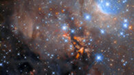 The dark vertical streak at the center of this Hubble image hides the protostellar object OH 339.88-1.26. Image credit: NASA / ESA / Hubble / J. Tan.