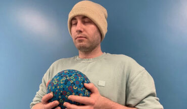 University of Bath Ph.D. student Alexz Farrall with a PAWS ‘breathing’ ball. Image credit: University of Bath.