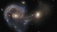 This Hubble image shows Arp 107, a pair of merging galaxies in the constellation of Leo Minor. Image credit: NASA / ESA / Hubble / J. Dalcanton.