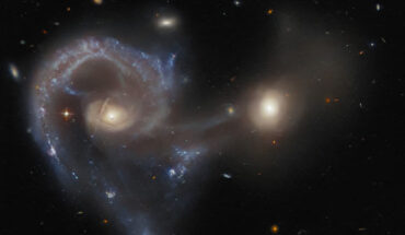 This Hubble image shows Arp 107, a pair of merging galaxies in the constellation of Leo Minor. Image credit: NASA / ESA / Hubble / J. Dalcanton.