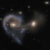 This Hubble image shows Arp 107, a pair of merging galaxies in the constellation of Leo Minor. Image credit: NASA / ESA / Hubble / J. Dalcanton.