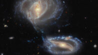 This Hubble image shows Arp-Madore 2339-661, a group of three interacting galaxies some 500 million light-years away in the constellation of Tucana. The color image was made from separate exposures taken in the visible and infrared regions of the spectrum with Hubble’s Advanced Camera for Surveys (ACS) and the Dark Energy Camera (DECam) on the Víctor M. Blanco 4-m telescope at Cerro Tololo Inter-American Observatory. Four filters were used to sample various wavelengths. The color results from assigning different hues to each monochromatic image associated with an individual filter. Image credit: NASA / ESA / Hubble / J. Dalcanton, Dark Energy Survey / DOE / FNAL / NOIRLab / NSF / AURA / L. Shatz.