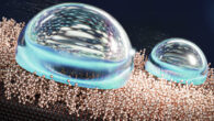 An artist’s depiction of the liquid-like layer of molecules repelling water droplets. Image credit: Ekaterina Osmekhina / Aalto University