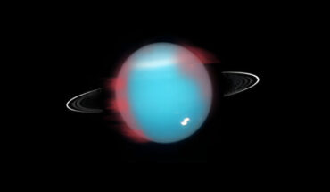 An artistic representation of how Uranus’ northern infrared aurora (marked in red) would have looked like in 2006. Image credit: NASA / ESA / M. Showalter, SETI Institute / Hubble Space Telescope.