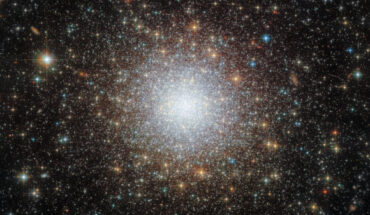 This Hubble image shows NGC 2210, a globular cluster located 163,000 light-years away in the constellation of Dorado. Also known as ESO 57-71 or LW 423, the cluster was first discovered on January 31, 1835 by the English astronomer John Herschel. The color image is made up of observations from Hubble’s Advanced Camera for Surveys (ACS) and Wide Field Camera 3 (WFC3) and in the ultraviolet, near-infrared, and optical parts of the spectrum. It is based on data obtained through three filters. The color results from assigning different hues to each monochromatic image associated with an individual filter. Image credit: NASA / ESA / Hubble / A. Sarajedini / F. Niederhofer.